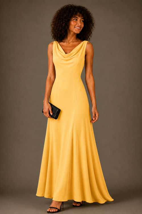 A woman modeling a sleeveless, cowl-neck, floor-length yellow dress against a solid dark gray studio background. She is holding a small black clutch and wearing black flat sandals.