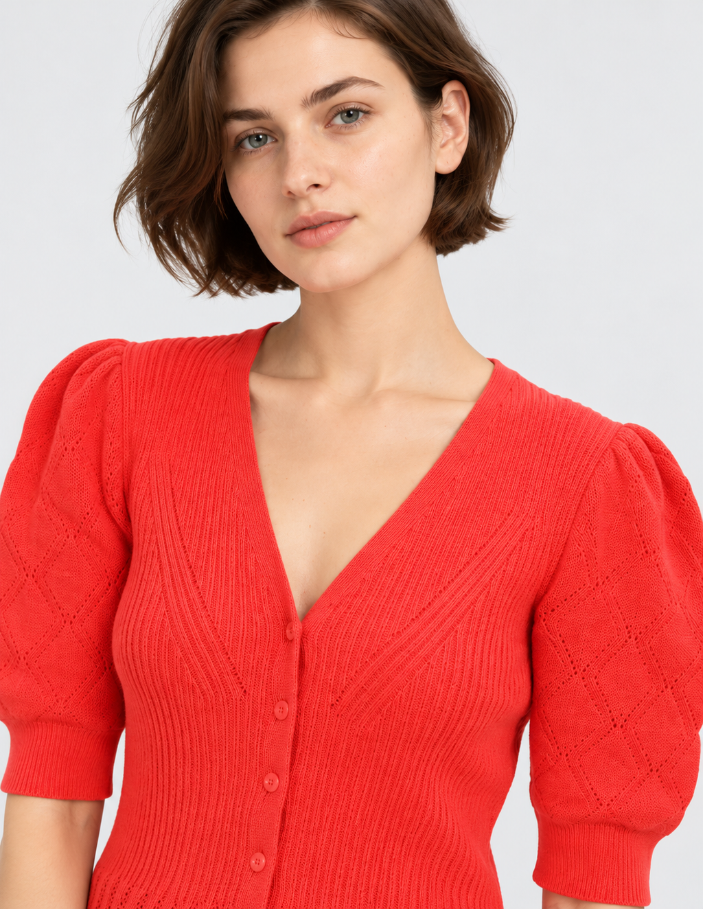 women's coral red cotton knit cardigan with puff sleeves and button-front closure