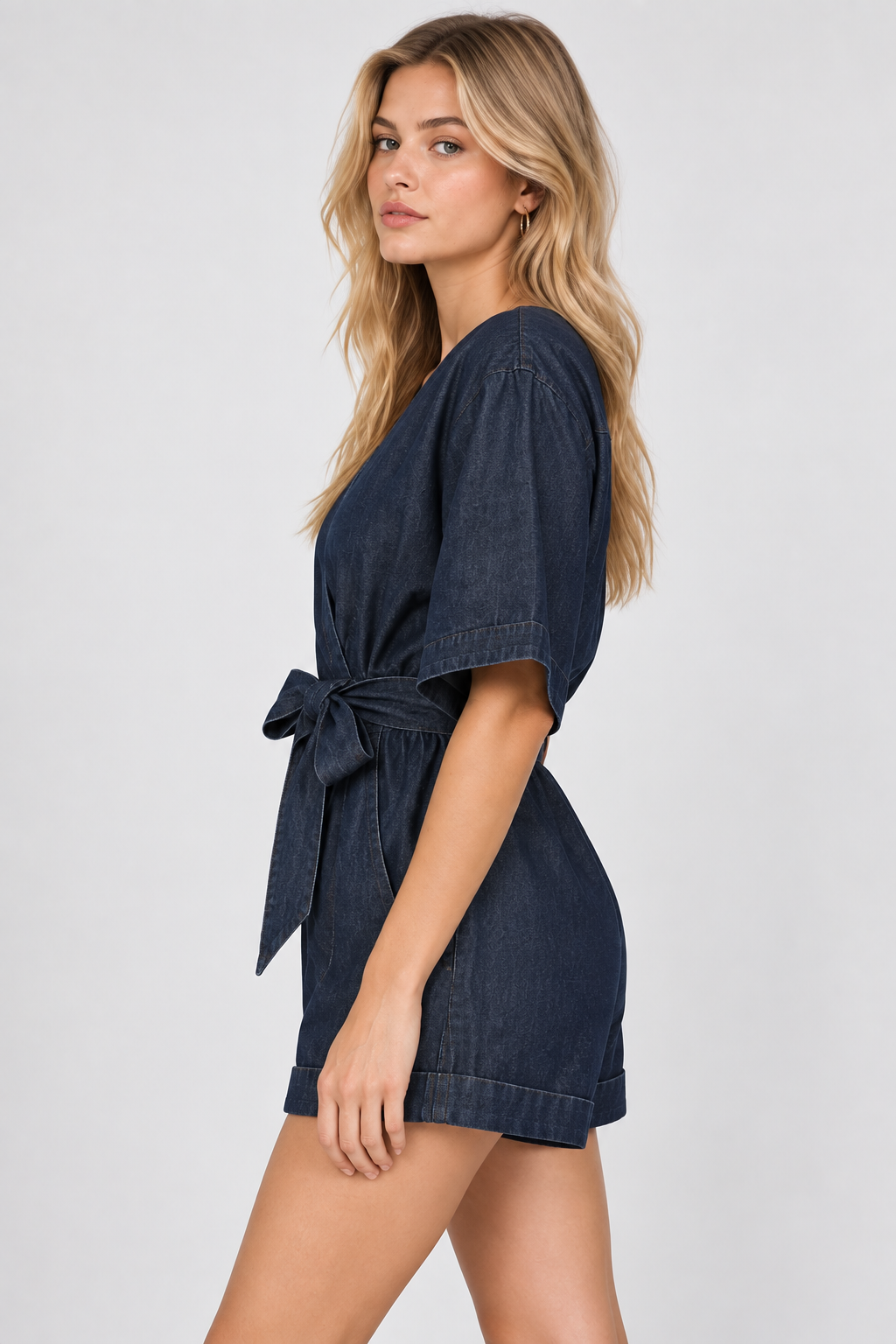 women's dark blue denim wrap romper with tie waist and cuffed shorts
