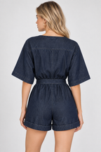 women's dark blue denim wrap romper with tie waist and cuffed shorts