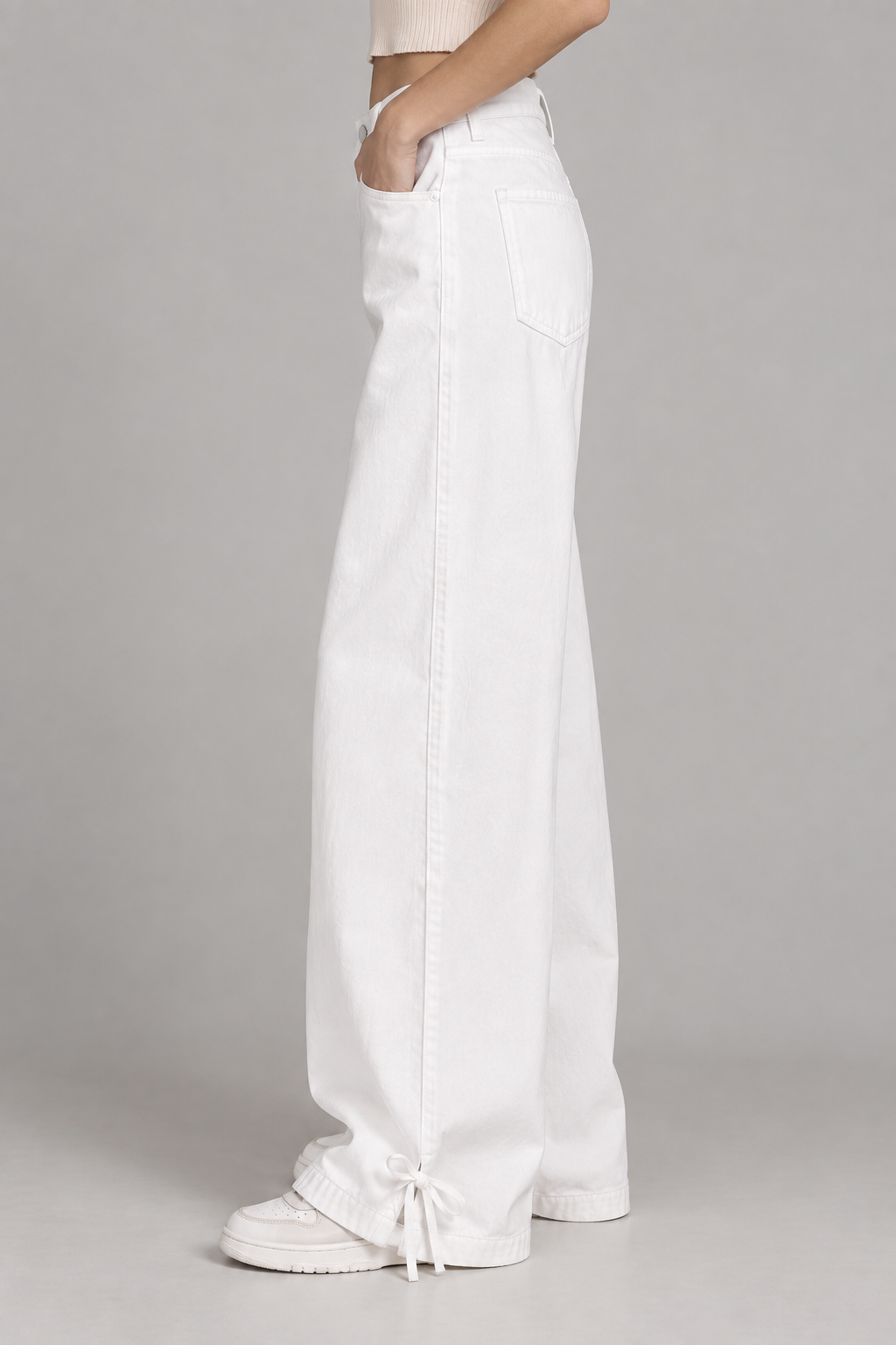 women's white wide-leg denim pants with ankle tie detail