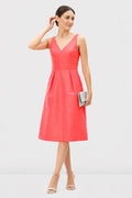 Sleeveless V-neck A-line dress in dupioni fabric with banded empire waist, designed for wedding guests, by Nams Ropa.