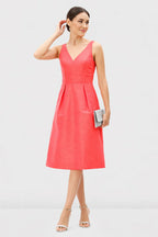 Sleeveless V-neck A-line dress in dupioni fabric with banded empire waist, designed for wedding guests, by Nams Ropa.