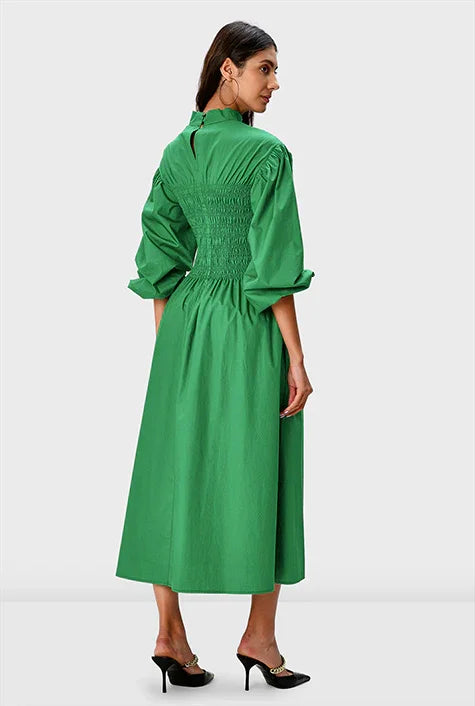 Nams-Ropa smocked cotton poplin midi dress with high neck and puff sleeves, showcasing its elegant, lightweight summer design.