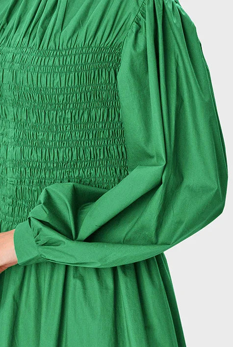 Nams-Ropa smocked cotton poplin midi dress with high neck and puff sleeves, showcasing a stylish and comfortable design.