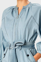 Light wash cotton denim zip-front palazzo jumpsuit with wide legs and belt from Nams-Ropa, styled as a single-piece outfit.