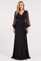 A woman modeling a floor-length black gown with a deep V-neckline, sheer long balloon sleeves, and a gathered waist detail, photographed against a plain light gray studio background.