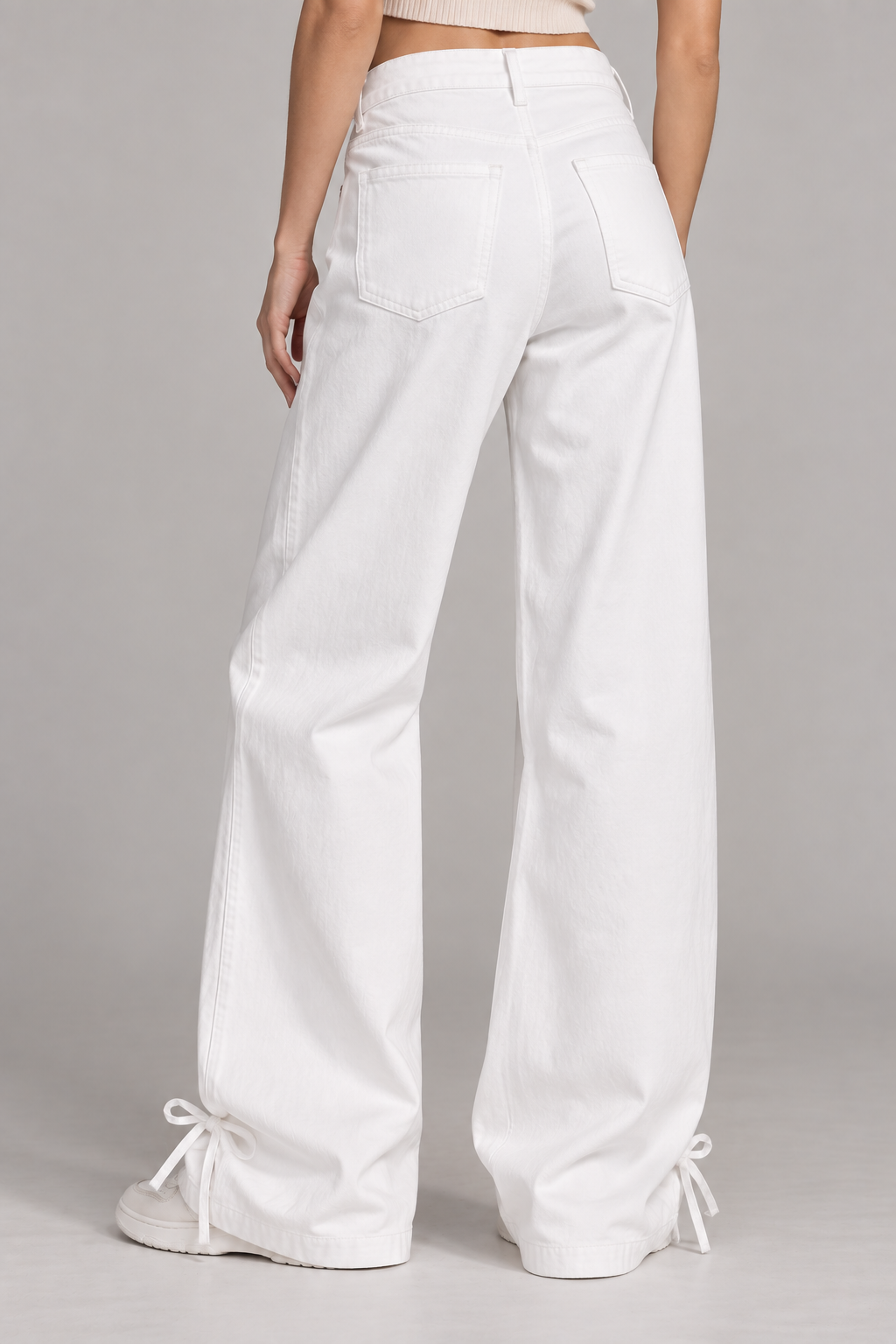 women's white wide-leg denim pants with ankle tie detail
