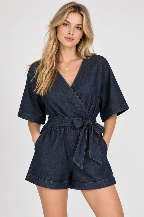 women's dark blue denim wrap romper with tie waist and cuffed shorts
