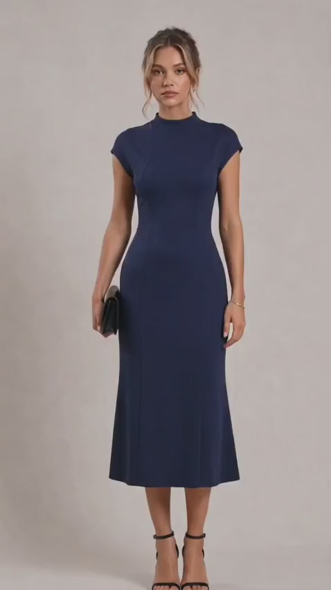 Navy blue polyester fitted midi dress with high neckline and short sleeves worn by a female fashion model.