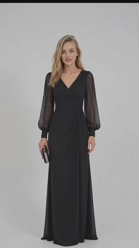 Black French crepe maxi dress featuring a V-neckline, wrap-style ruched bodice, sheer long puff sleeves with fitted cuffs, gathered waist, and flowing floor-length skirt.
